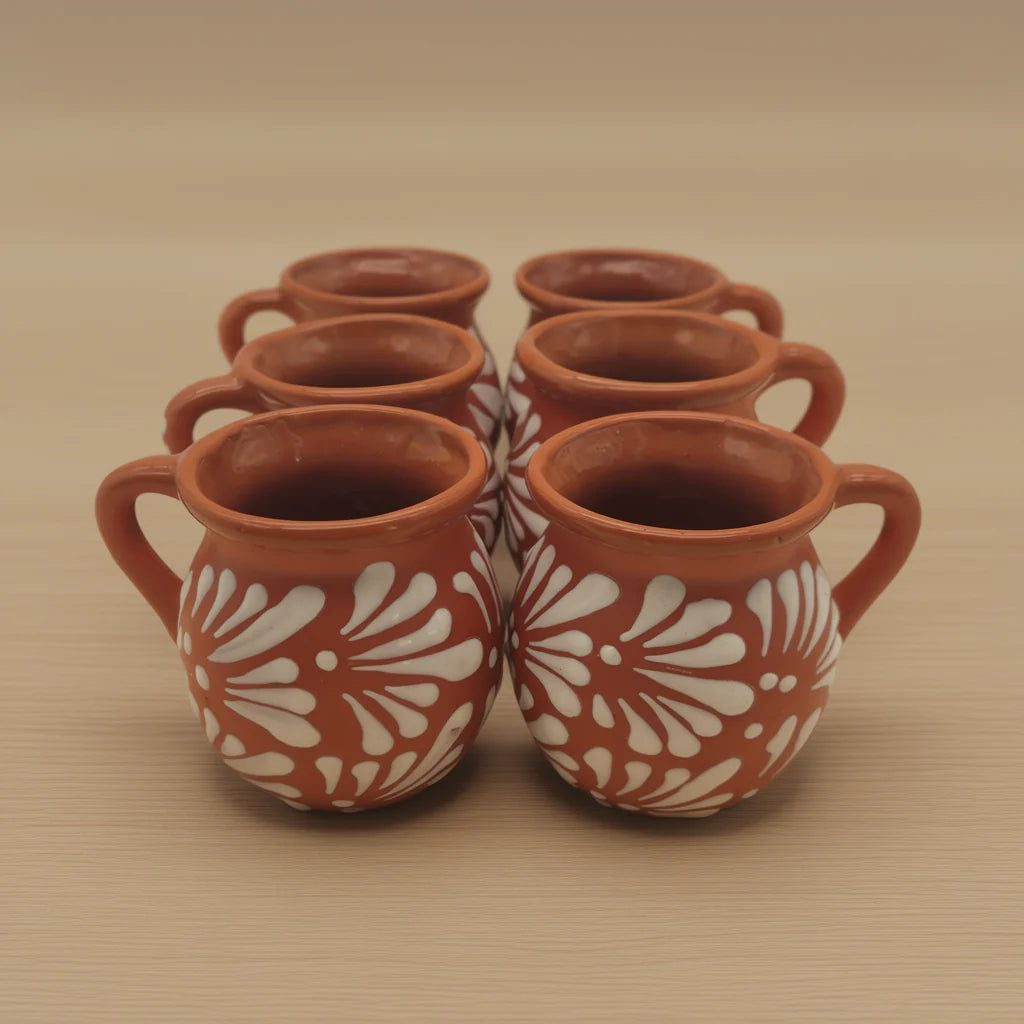 Handmade Mexican clay Talavera mug in brown pottery with colorful traditional patterns, crafted by The Talavera Hub.