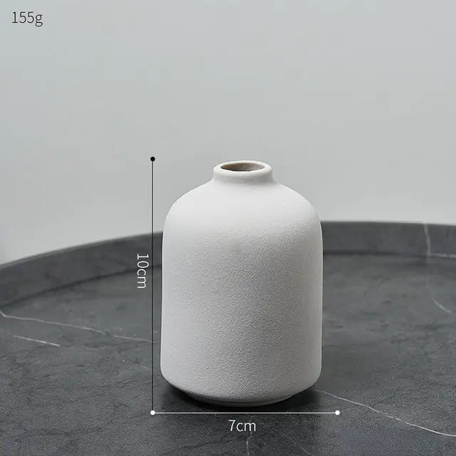 Simple Nordic-style ceramic vase with a smooth, minimalist design, perfect for modern home decor.