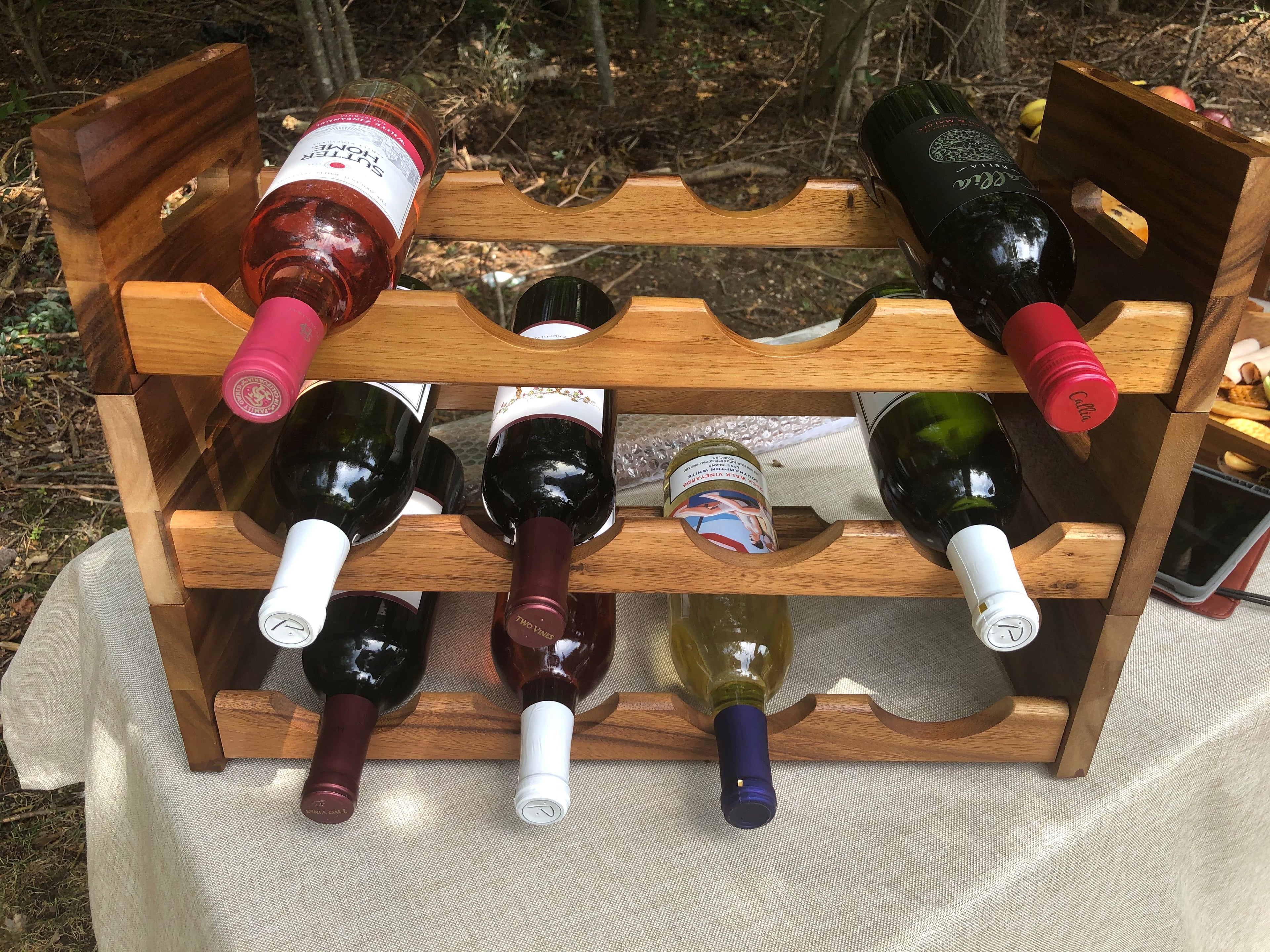 Kalmar Home stackable tabletop wine rack with multiple slots for organizing wine bottles on a flat surface.