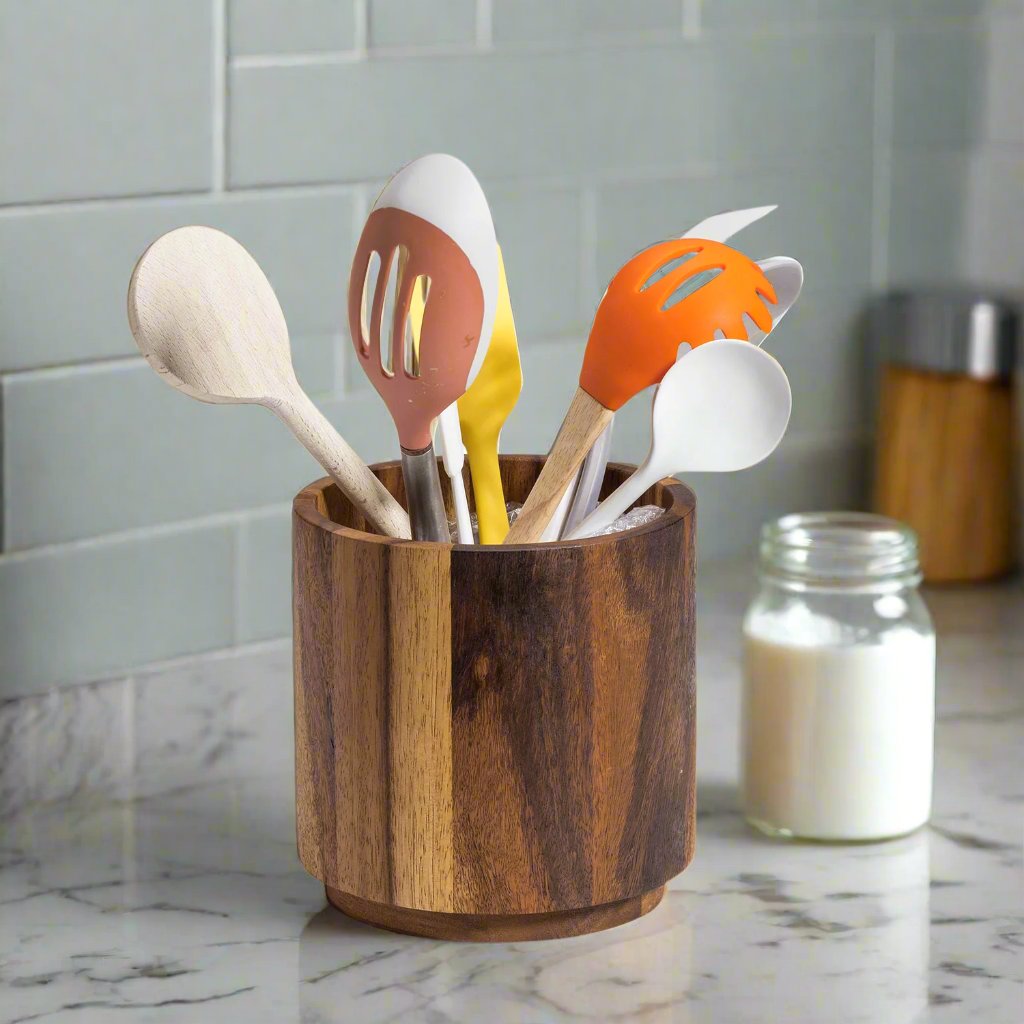 Kalmar Home rotating lazy Susan utensil holder on a tabletop, featuring multiple compartments for kitchen utensils and accessories.