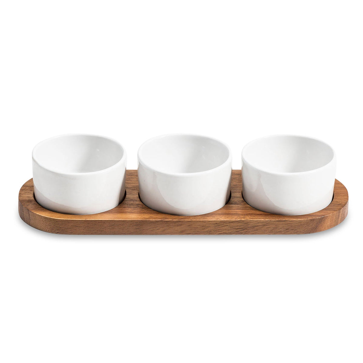 Ceramic condiment set with four bowls on a round acacia wood serving tray, designed for Kalmar Home kitchen table use.