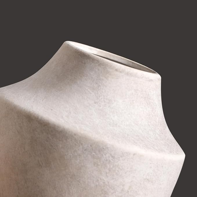 CozyNest Decor terracotta vases with a rustic finish, showcasing their round shape and textured surface on a neutral background.