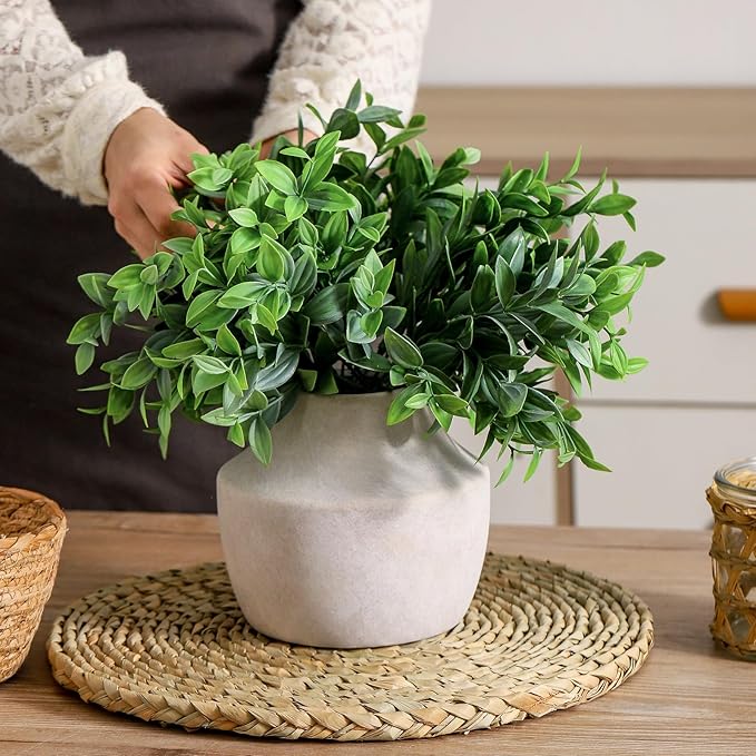 CozyNest Decor terracotta vases with smooth finish and rounded shape, ideal for rustic home decor and plant arrangements.