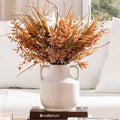 Rustic terracotta vase from CozyNest Decor with a natural, textured finish, perfect for rustic or bohemian decor styles.