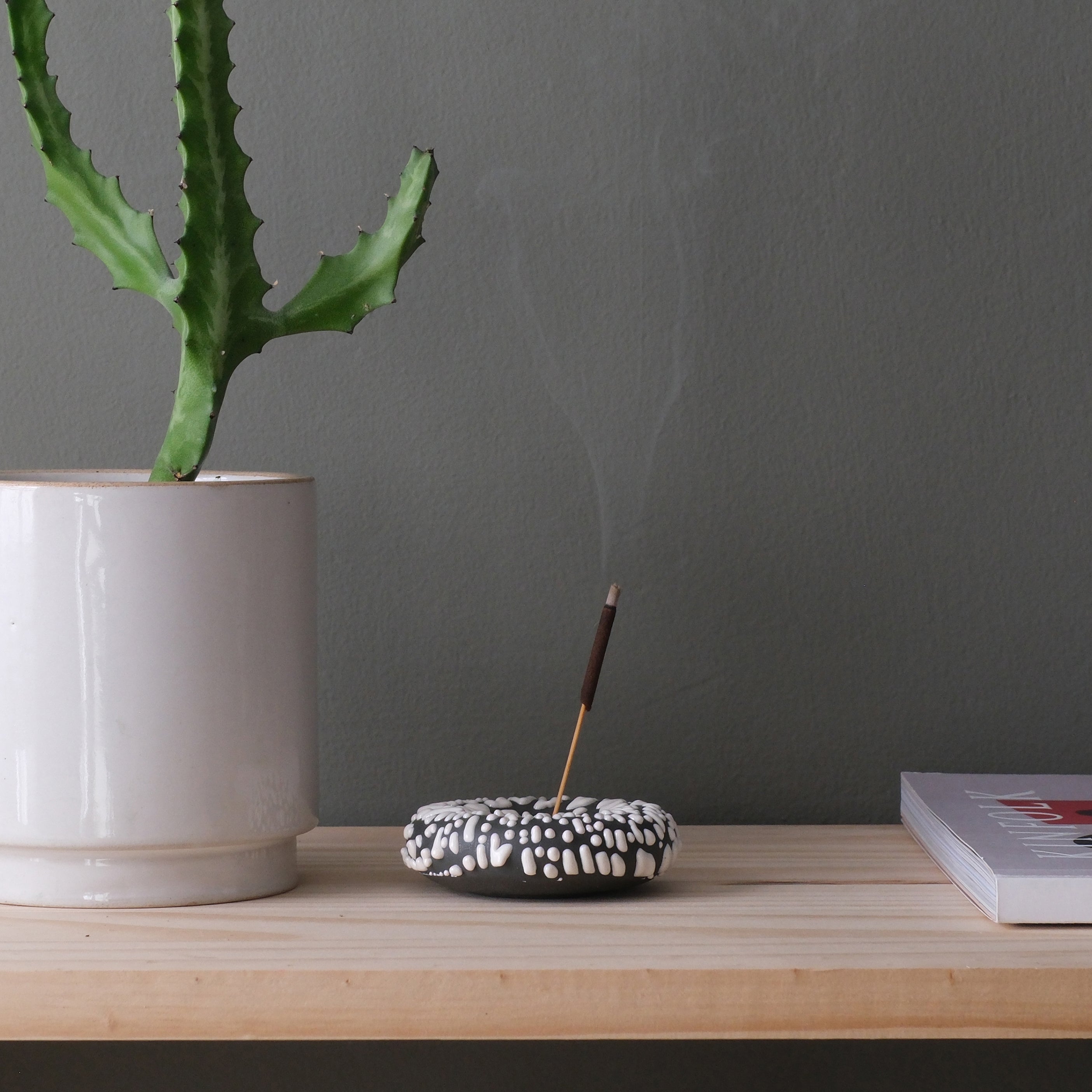 Black Eve Incense sticks by Misewell, displayed in a home accessories setting with burning incense and aromatic smoke.