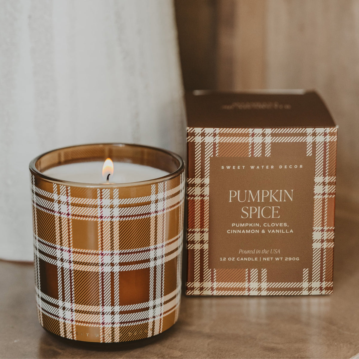 Pumpkin Spice soy candle in a tinted glass jar, 12 oz, from Sweet Water Decor, perfect for fall ambiance.