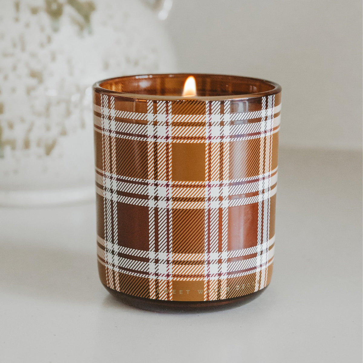 Sweet Water Decor Pumpkin Spice soy candle in a boxed tinted glass jar, 12 oz, perfect for fall fragrance and cozy ambiance.