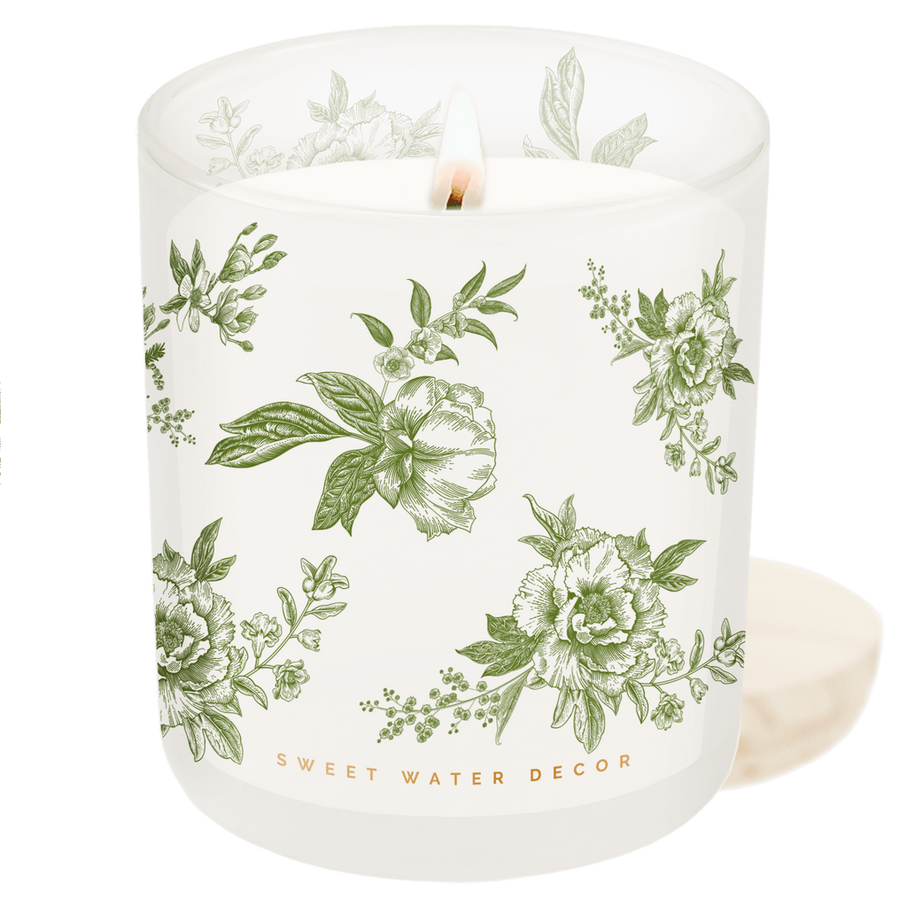 Green floral soy candle by Sweet Water Decor in a 12oz patterned container, perfect for home decor and ambient lighting.