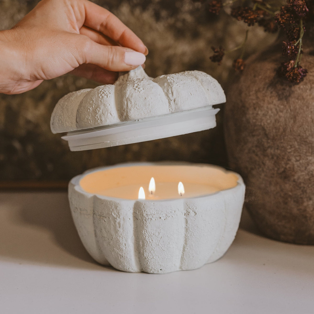 Sweet Water Decor cashmere and vanilla soy candle in a cement pumpkin jar, 13.5 oz, perfect for fall decor.