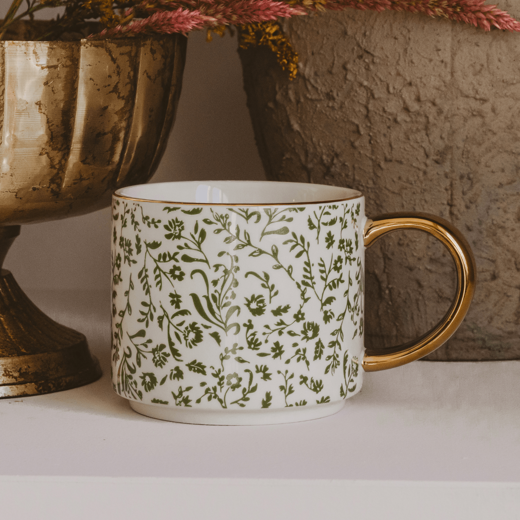Green Ditsy Floral 14 oz coffee mug from Sweet Water Decor with a colorful floral pattern on ceramic.