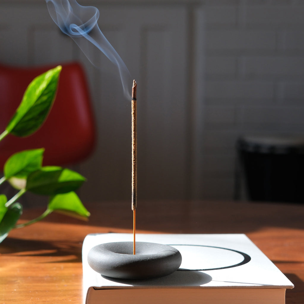 Misewell Eve Incense as a stylish home accessory, displayed in a decorative container on a modern surface.