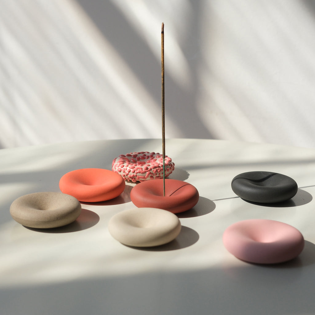Set of Misewell Eve Incense home accessories with incense sticks and holder on a white background.