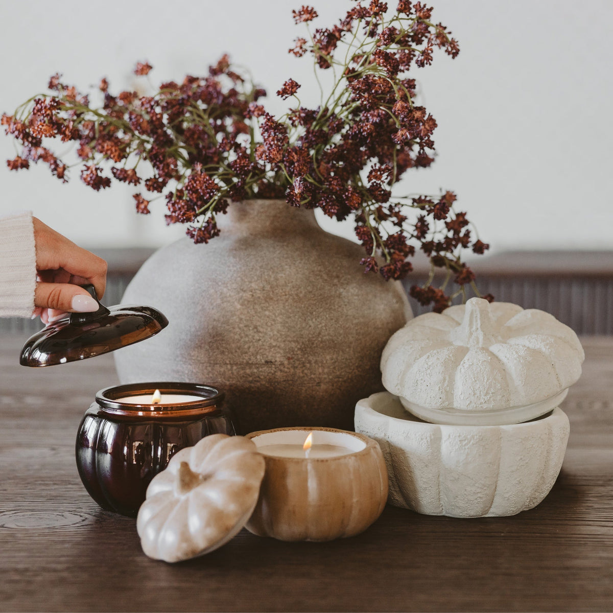 Sweet Water Decor pumpkin spice soy candle in a ceramic pumpkin jar, 8 oz, featuring a cozy autumn-themed figurine design.