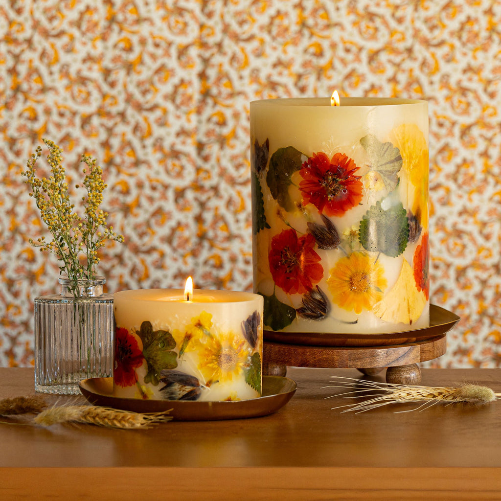Small botanical candle with harvest pumpkin design from Rosy Rings, featuring autumn-inspired botanical accents and warm candle flame.