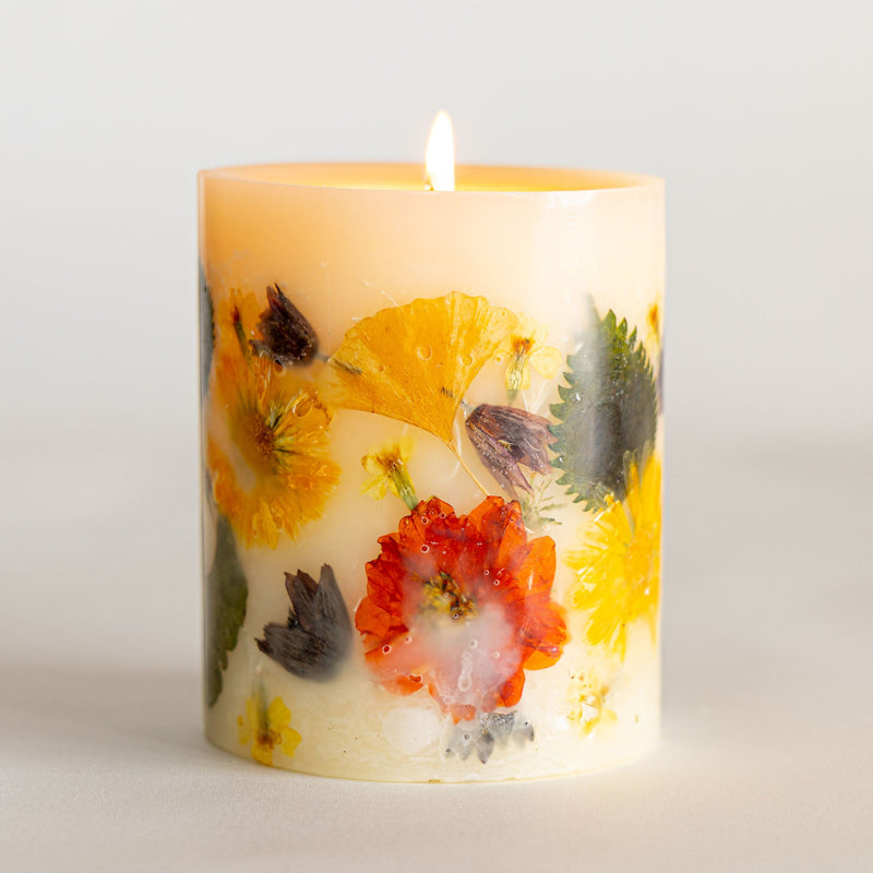 Small botanical candle by Rosy Rings featuring harvest pumpkin design, with warm autumn-inspired botanical accents.