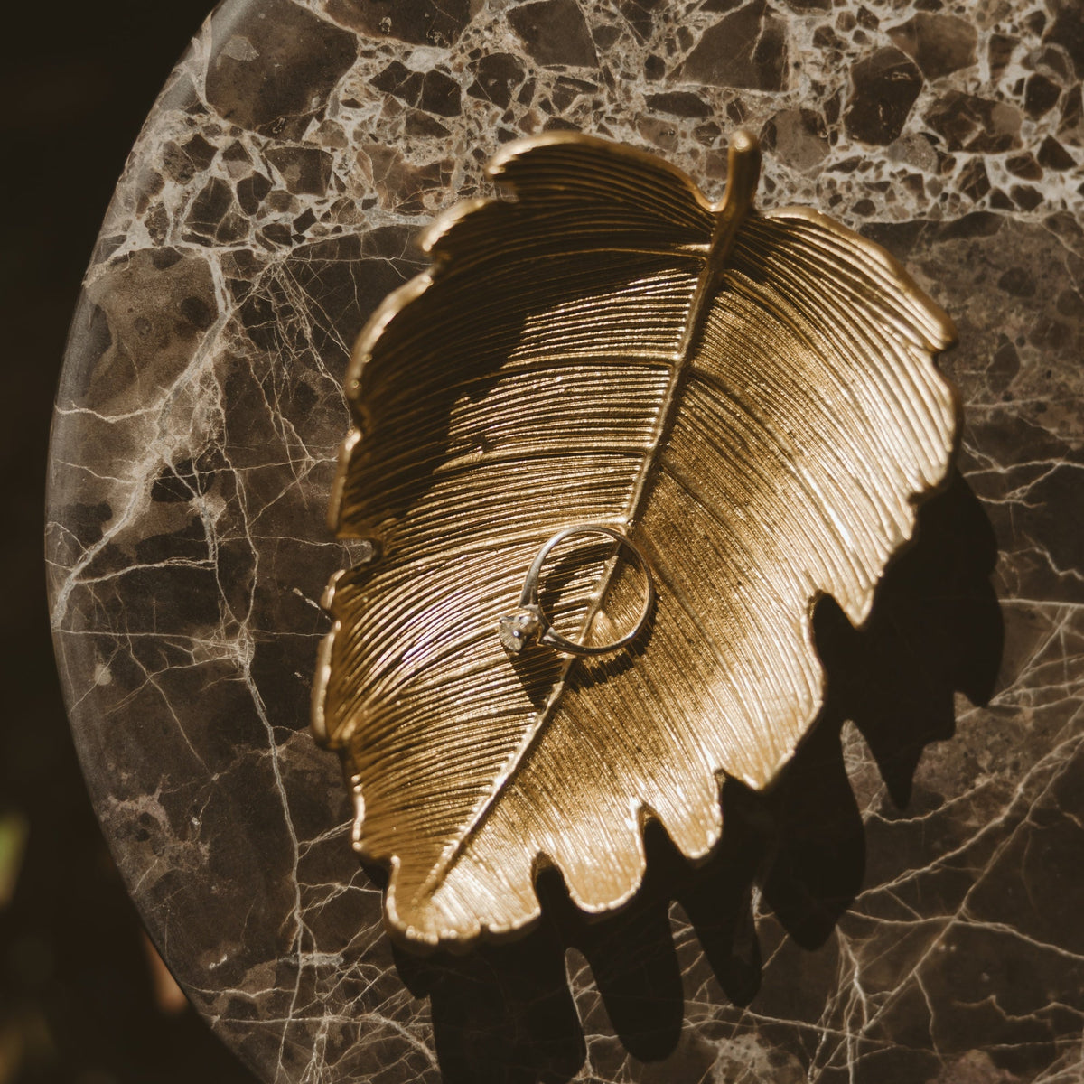 Gold leaf jewelry dish by Sweet Water Decor, decorative jewelry tray for earrings, rings, and necklaces with a leaf design.