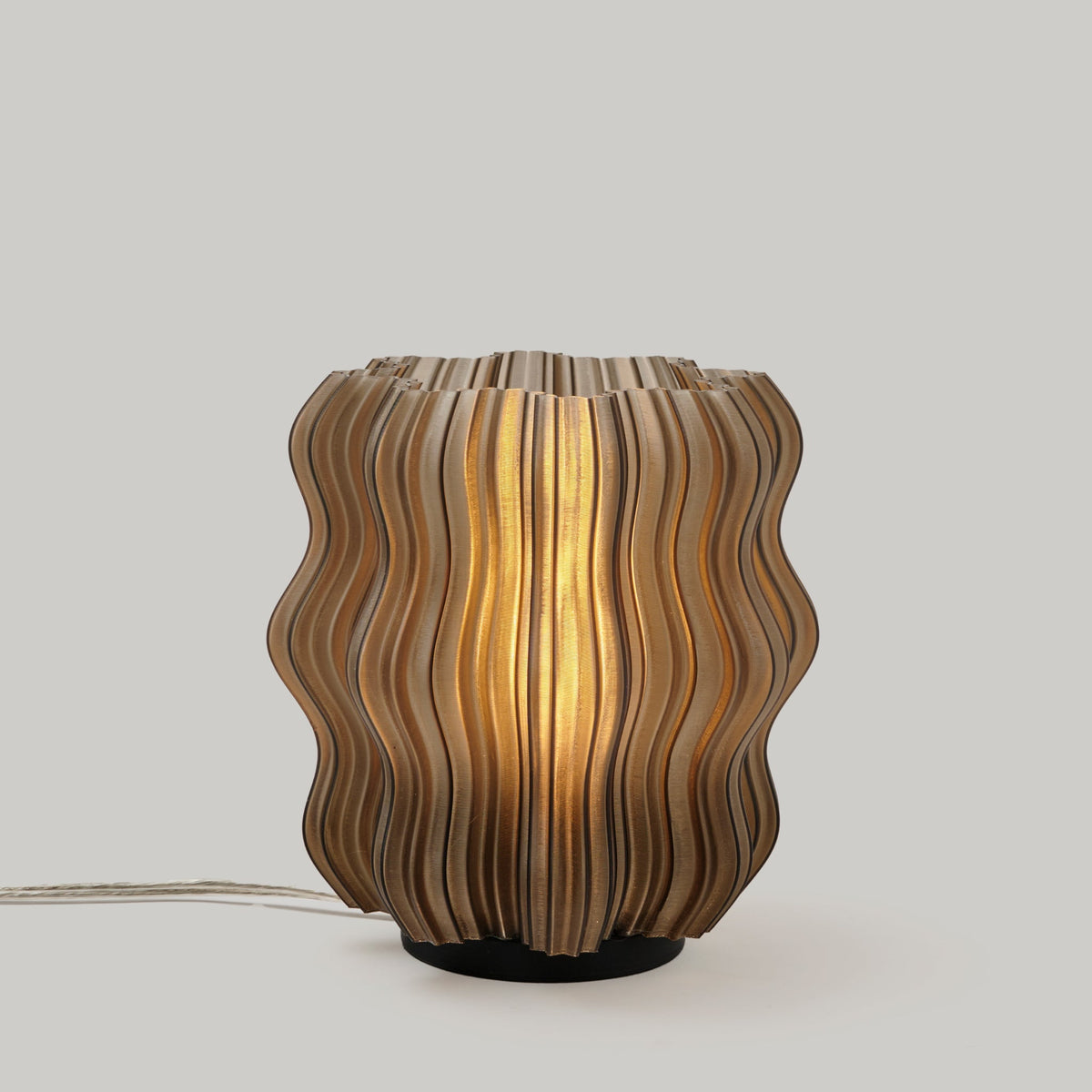 Mini Wavy Lamp by Wooj Design featuring a sleek, wavy design with a smoky finish, perfect for modern home lighting.