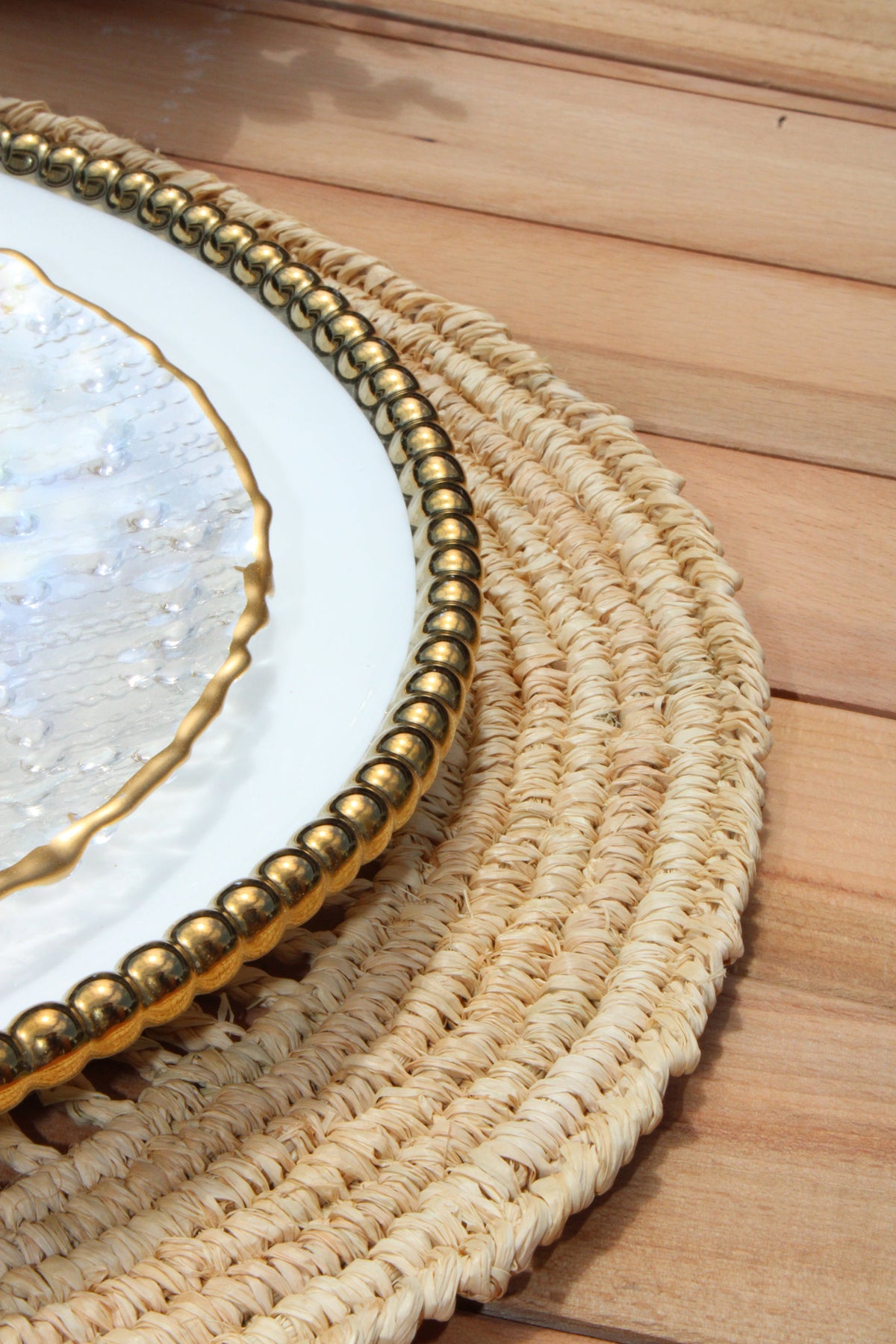 Natural woven crochet placemat by Payton James featuring a raffia tabletop design for elegant table setting.