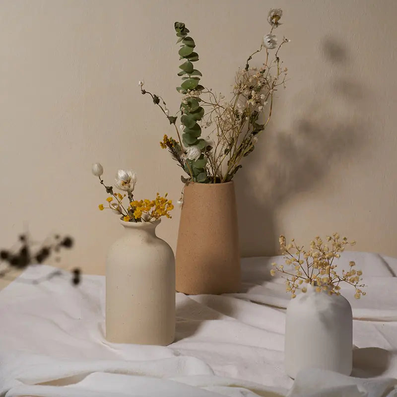 Simple ceramic vase with a smooth finish, ideal for home décor, by My Store.