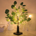 Artificial eucalyptus tree by Perfecsy with green leaves and realistic foliage, ideal for home or office decor.