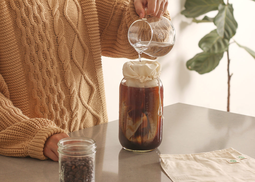 Organic Cotton Mart nut milk bags used as cheesecloth-style strainers for homemade nut milks and food straining.