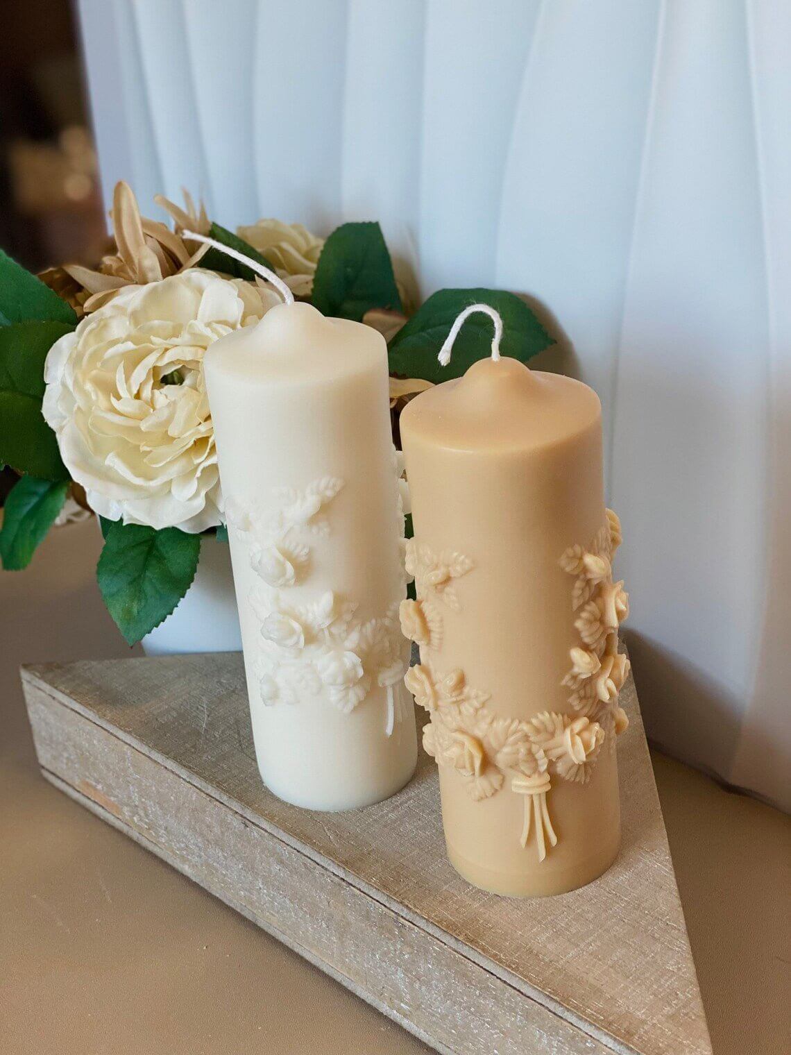 Floral pillar soy wax scented candle by Crazy About Candles with a decorative floral design and warm glow.