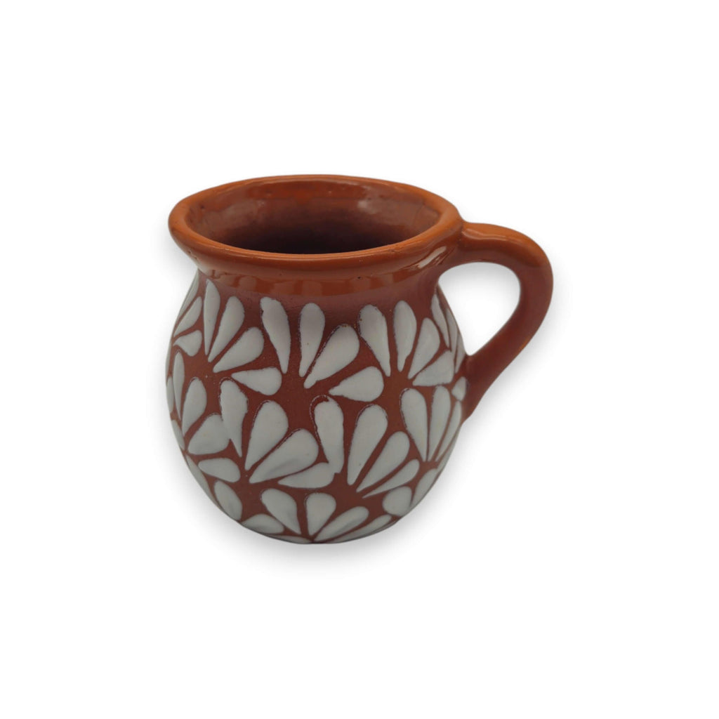 Handmade Mexican brown Talavera mug with intricate patterns, crafted from traditional clay pottery.