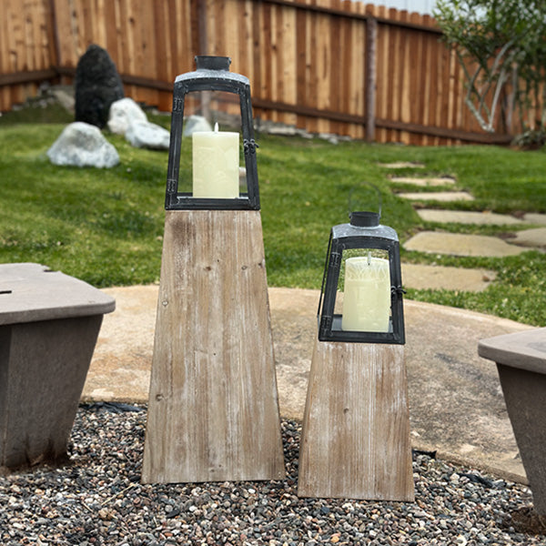 Set of two Decor Steals removable metal lanterns with wood bases, featuring glass panels and rustic design.