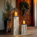 Set of two removable metal lanterns with wood bases from Decor Steals, featuring rustic design and glass panels.