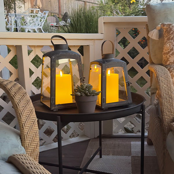 Set of two Decor Steals removable metal lanterns with wooden bases, featuring glass panels and candleholders.