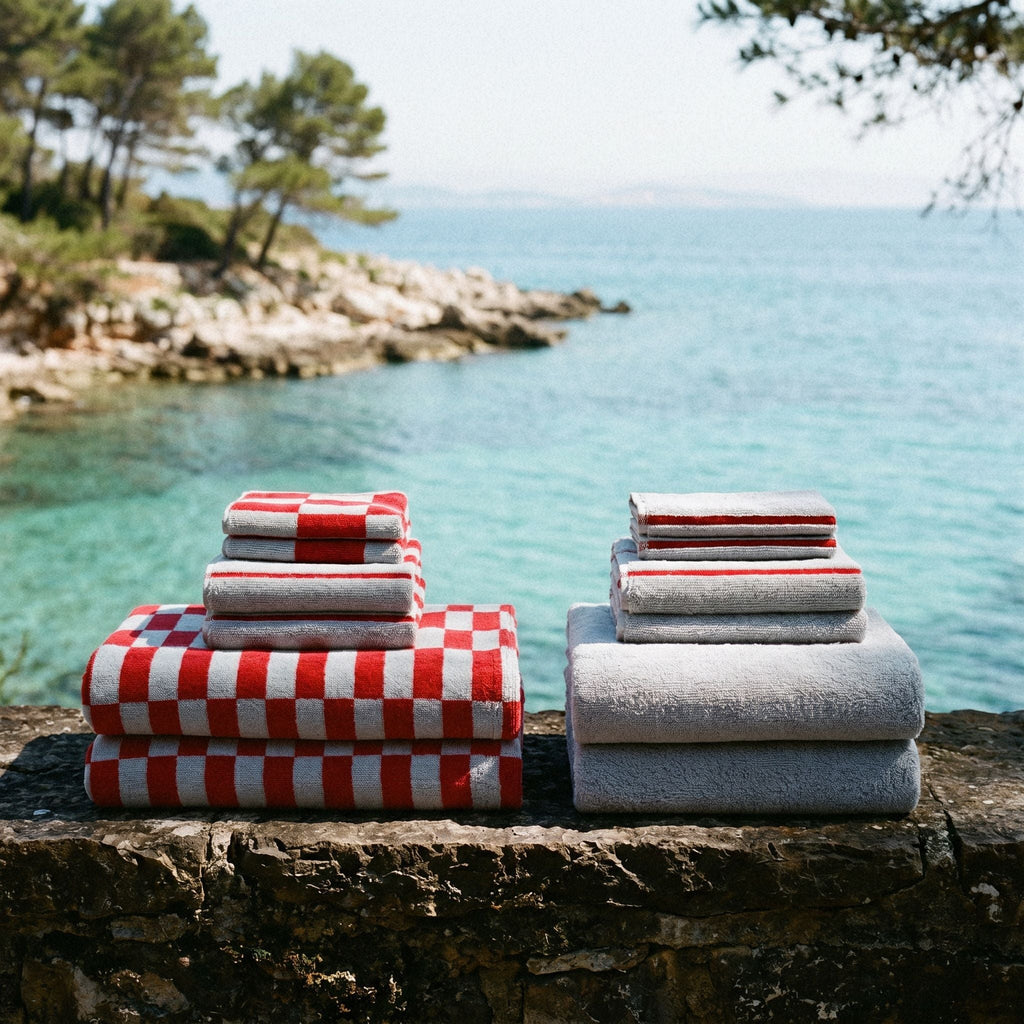 Soft white Pietra Australian cotton towels by Italic, neatly folded with plush texture and subtle weave pattern visible.
