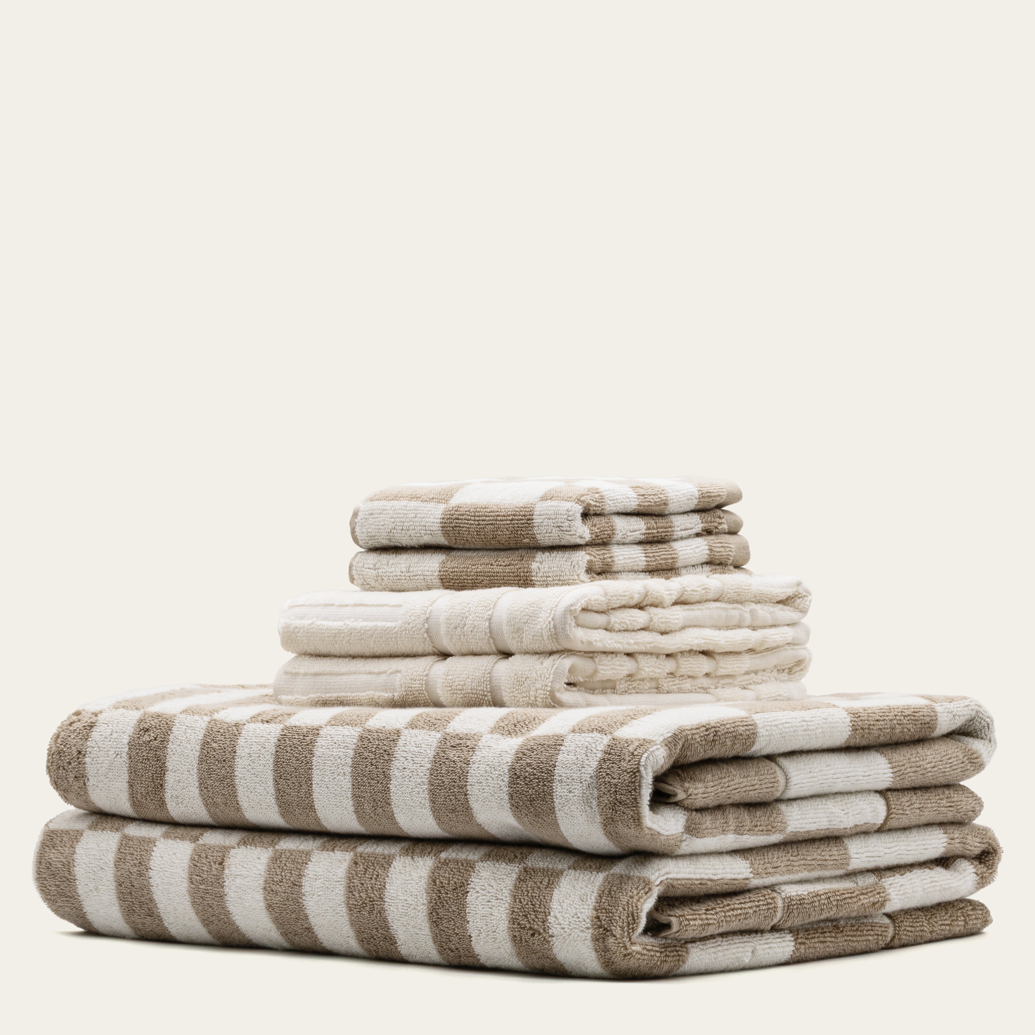 Soft Pietra Australian Cotton Towels by Italic, featuring plush texture and neutral color, displayed folded on a clean bathroom surface.