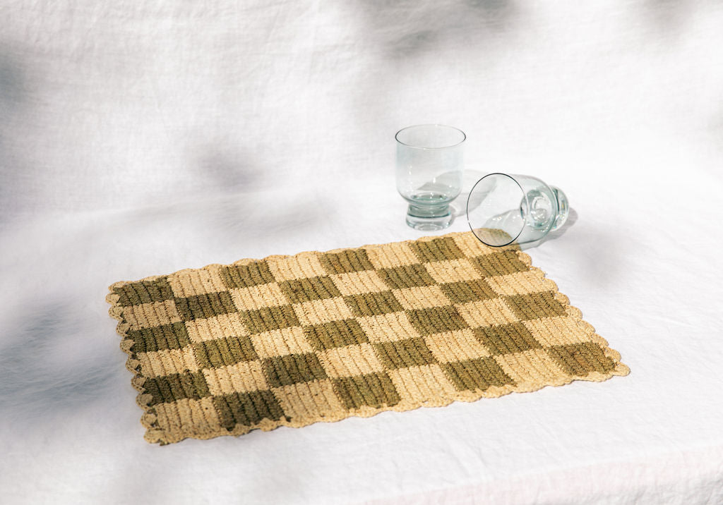 Rectangular green checked raffia placemat from Payton James, stylish tabletop accessory with a natural woven texture.