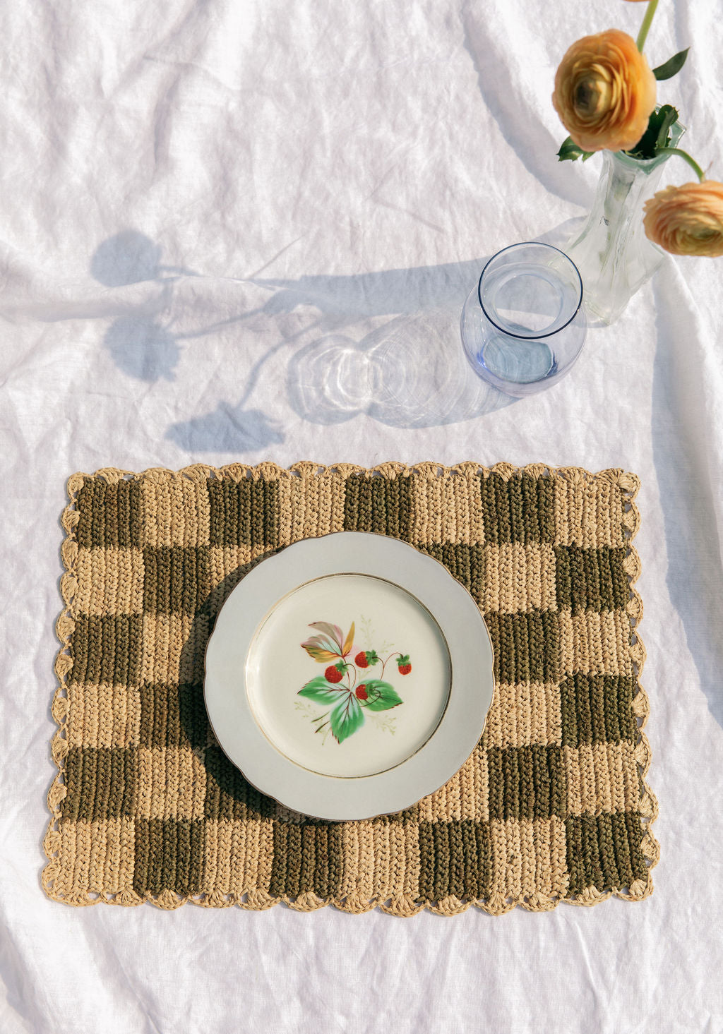 Green checked rectangular raffia table top placemat by Payton James, showcasing a stylish and natural woven design.
