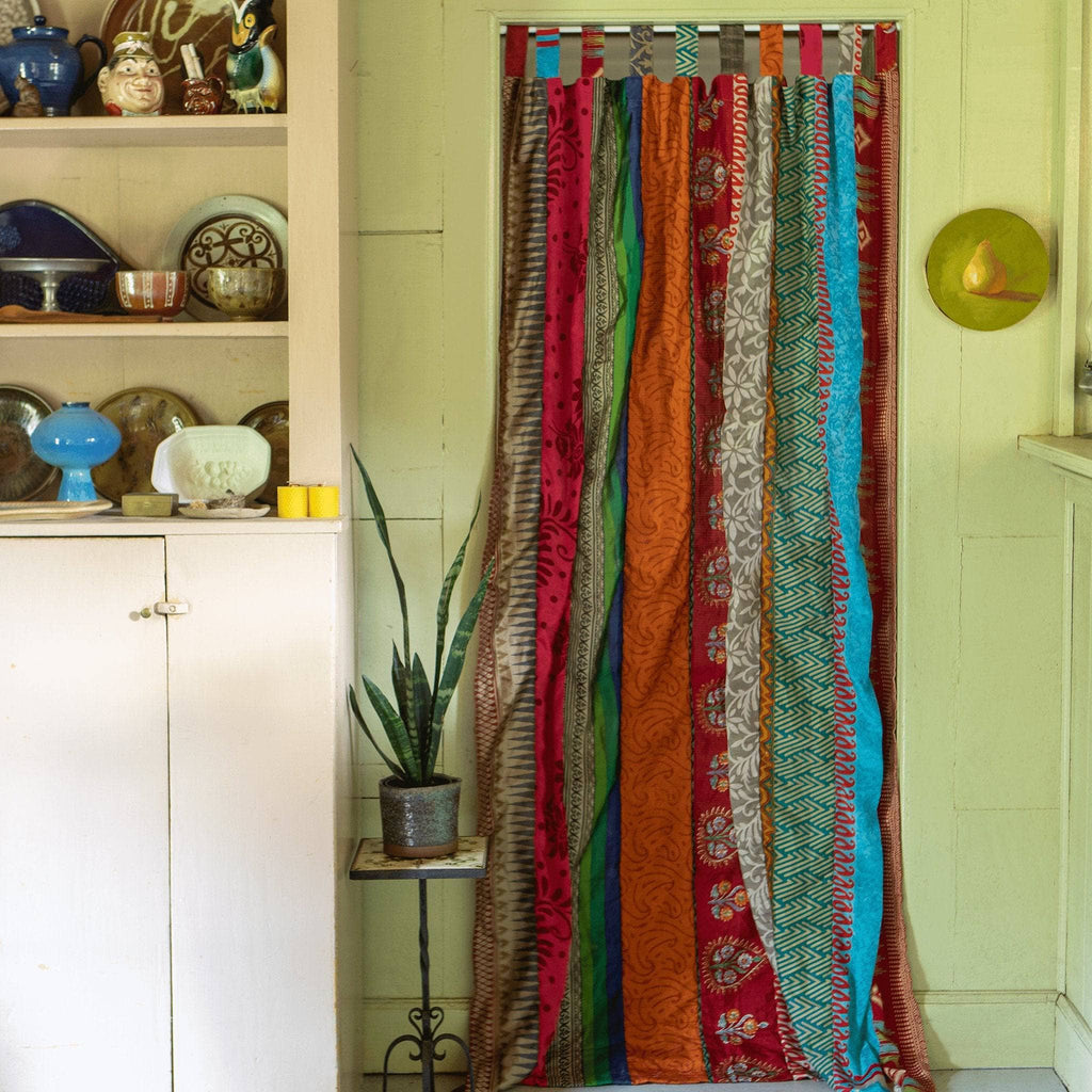 Rainbow Oasis recycled sari curtains by Darn Good Yarn featuring eco-friendly crochet and boho-inspired design for home decor.