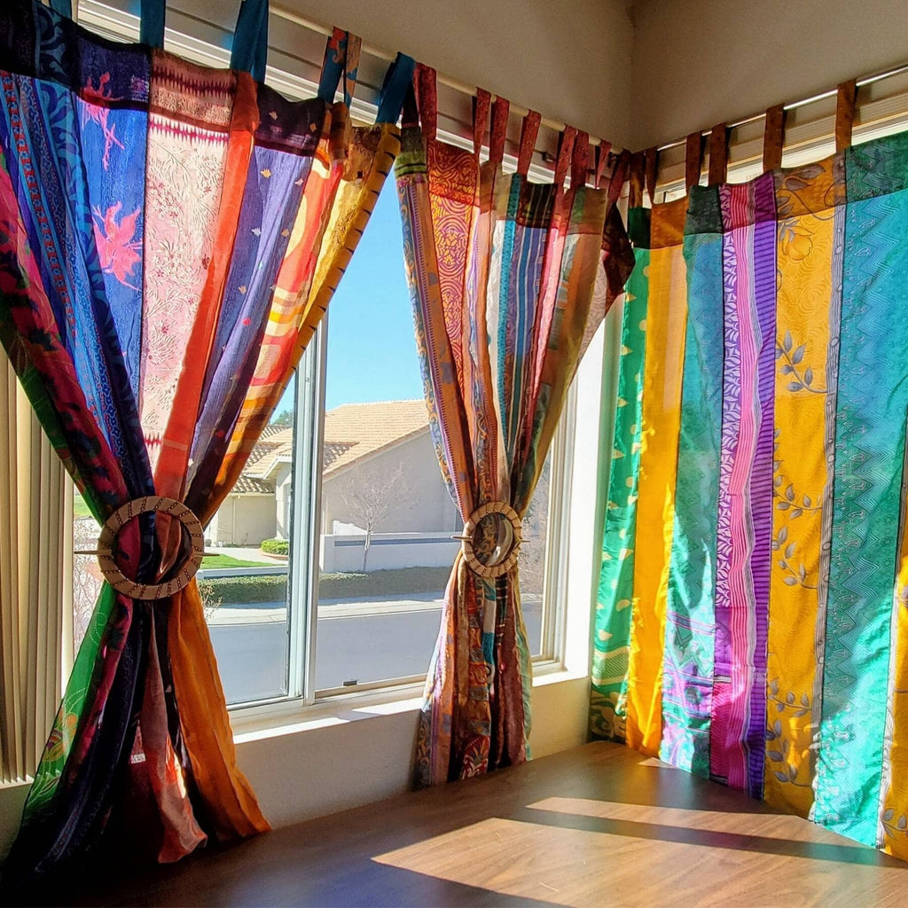 Rainbow Oasis recycled sari curtains by Darn Good Yarn, eco-friendly boho home decor with colorful crochet and knit details.