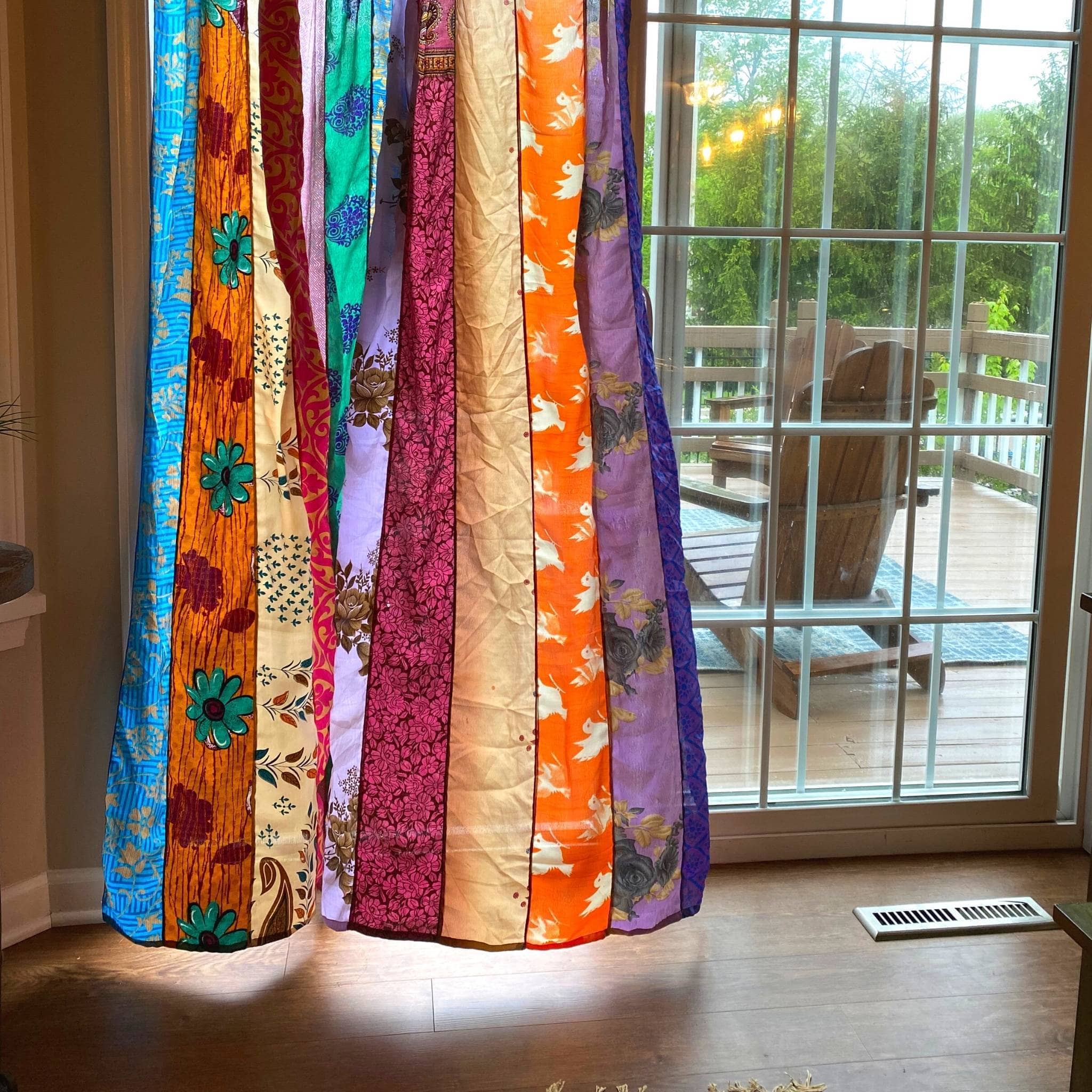 Rainbow Oasis recycled sari curtains by Darn Good Yarn, boho outdoor patio decor with eco-friendly crochet-knit design.