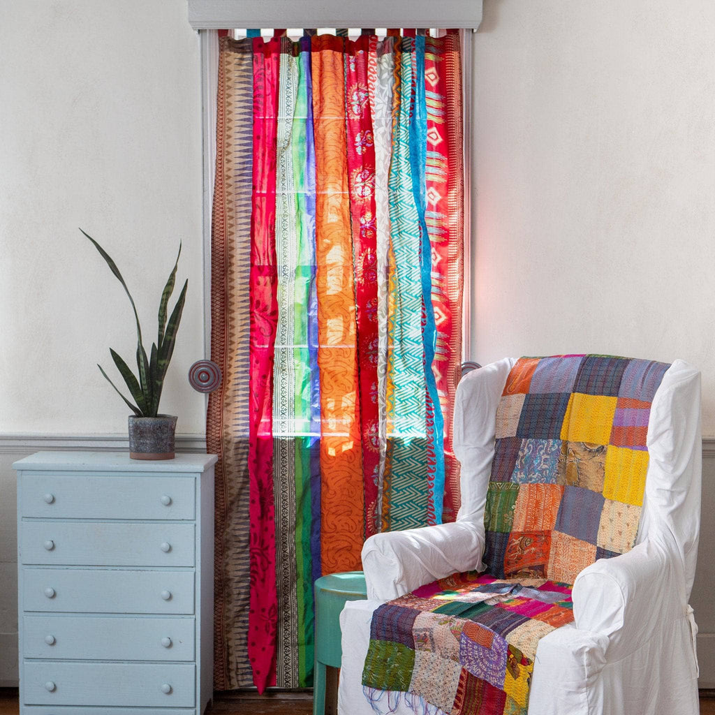 Rainbow Oasis recycled sari curtains by Darn Good Yarn, eco-friendly home decor with vibrant, boho-inspired crochet and knit accents.