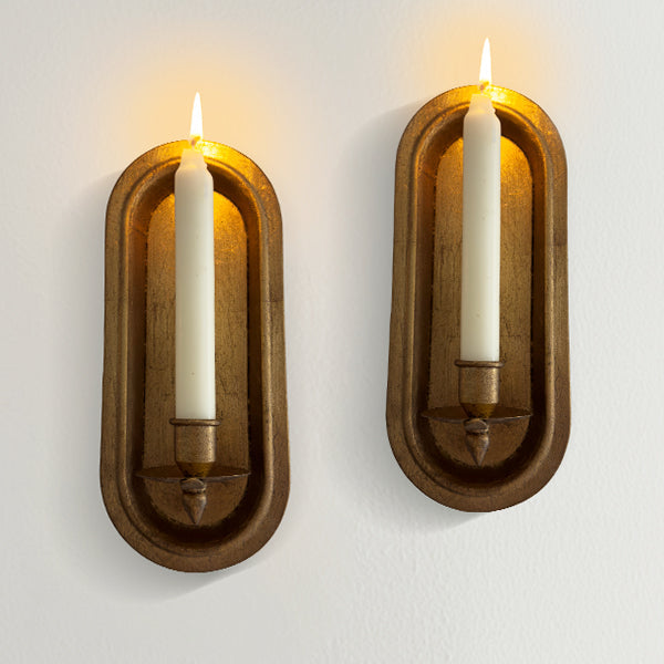 Pair of antique gold wall sconce candle holders with taper candle slots, decorative decor from Decor Steals.