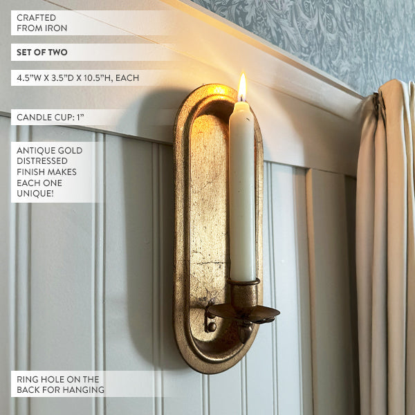 Set of two antique gold wall sconce candle holders with taper design, perfect for vintage or rustic decor.