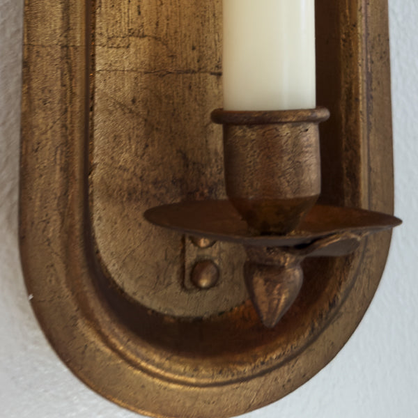 Pair of antique gold wall sconce candle holders with taper candle slots, decorative vintage-style decor by Decor Steals.
