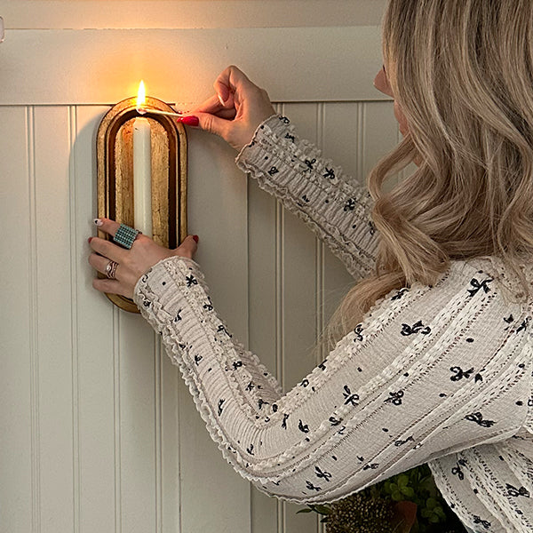 Pair of antique gold wall sconce candle holders with taper candle slots, decorative antique finish, by Decor Steals.