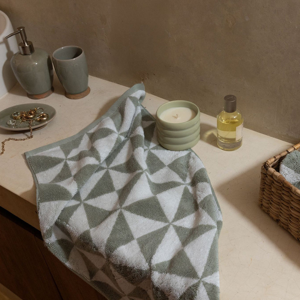Soft Australian cotton bath towel from Italic, featuring plush texture and white color, displayed folded in a home setting.